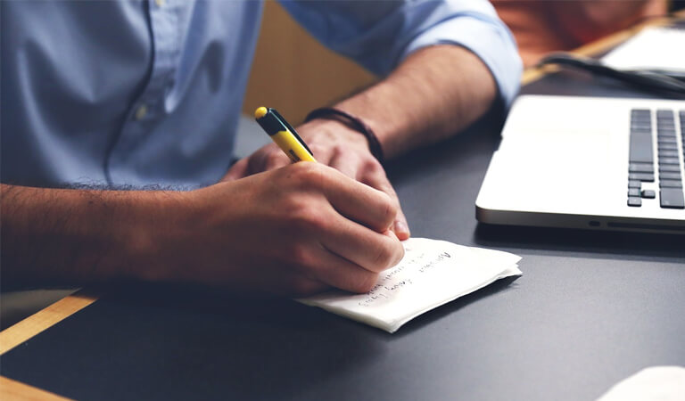 Man writing some notes